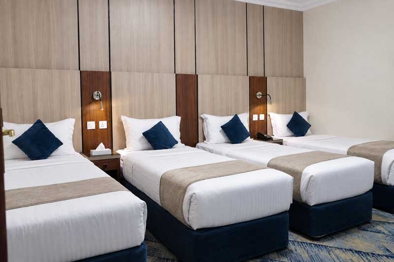 Taqwa Manazel Hotel modern four bed hotel room