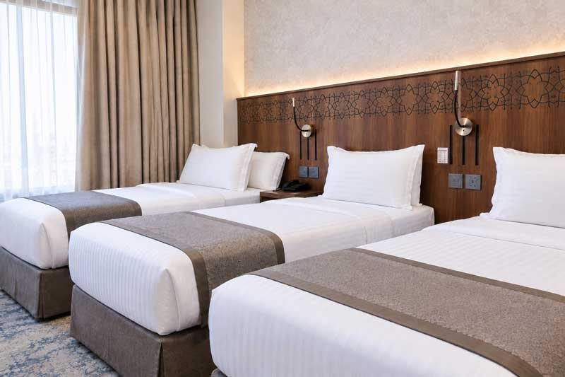 Taqwa Manazel Hotel triple bed